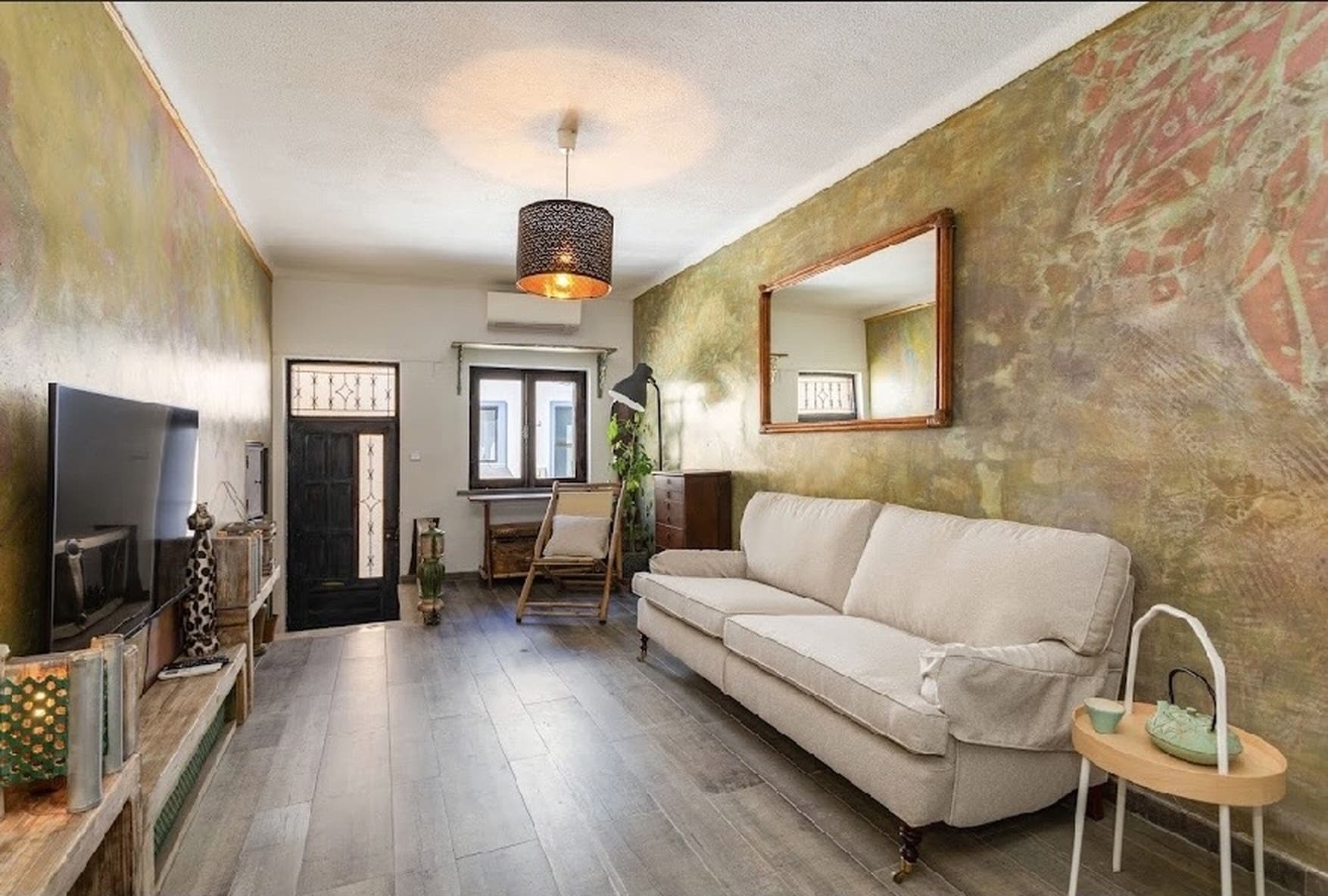 Lounge area with hand-painted African-inspired walls